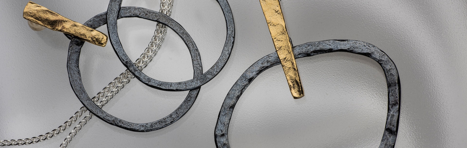 A silver jewelry collection enhanced with gilded, darkened and whitened silver finishes