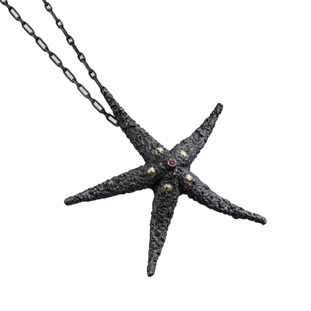 Darkened antique finish Silver Starfish Necklace highlighted with 18k gold leaves and ruby in the center