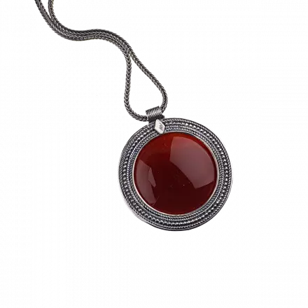 Silver Necklace with handcrafted round ethnic pendant set with stunning center Carnelian stone