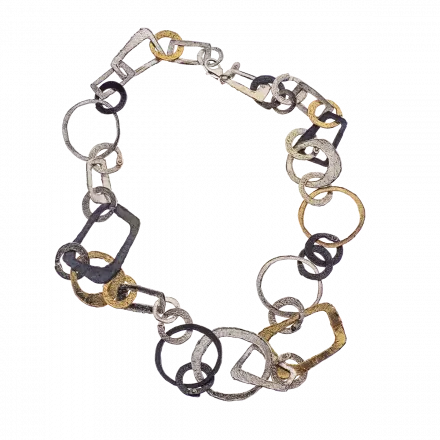 Silver Chain Necklace composed of white silver, darkened silver and gilded geometric links