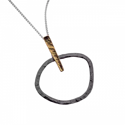 Silver Necklace highlighted with darkened silver hoop pendant and gilded hook