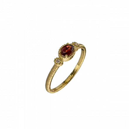 14k Gold Ring set with oval Garnet and Diamond on either side