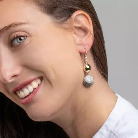 Silver Earrings with 2 domes, one of them set with a zircon and one wrapped in 9k gold