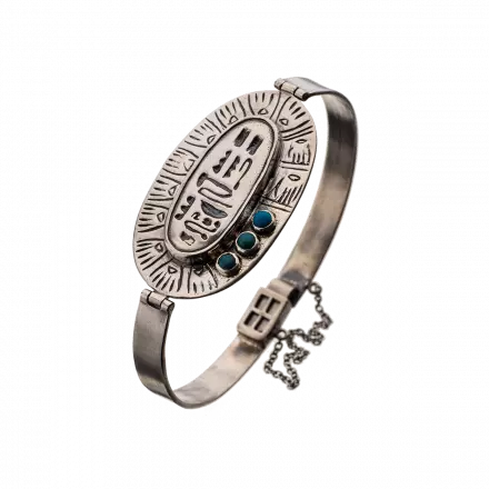 Silver Bangle embellished with turquoise stones and stunning center silver oval engraved with ancient Egyptian decoration  